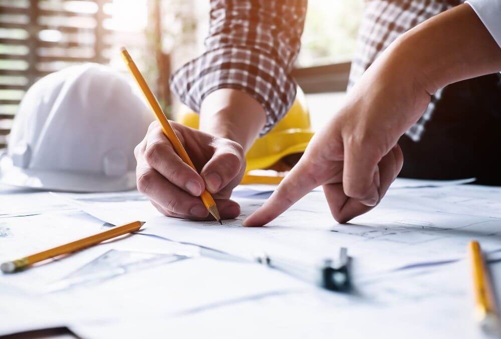 concrete contractor looking at a blueprint