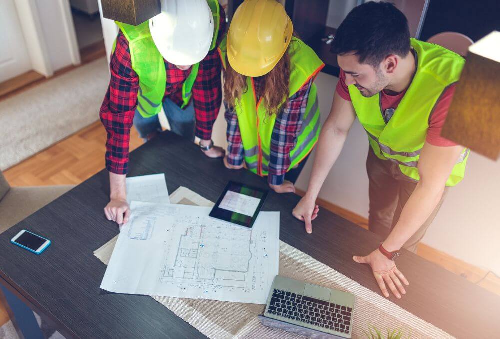 Contractors looking at a blueprint