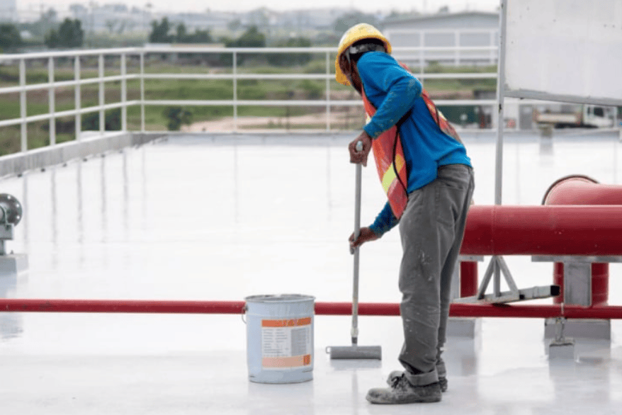 contractor applying waterproofing