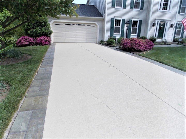 concrete driveway in front of house