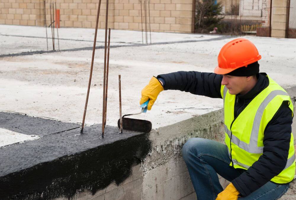 concrete contractor resurfacing the concrete pool deck