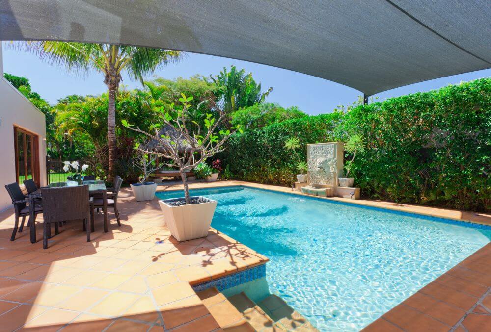 concrete pool deck with landscape design