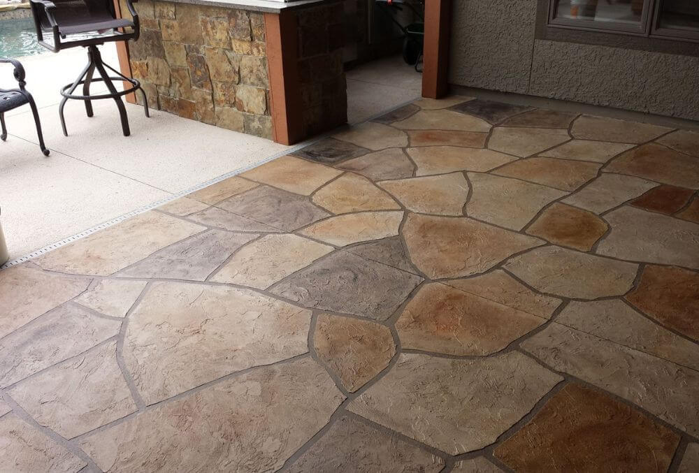 faux rug inspired stamped concrete floor in the patio