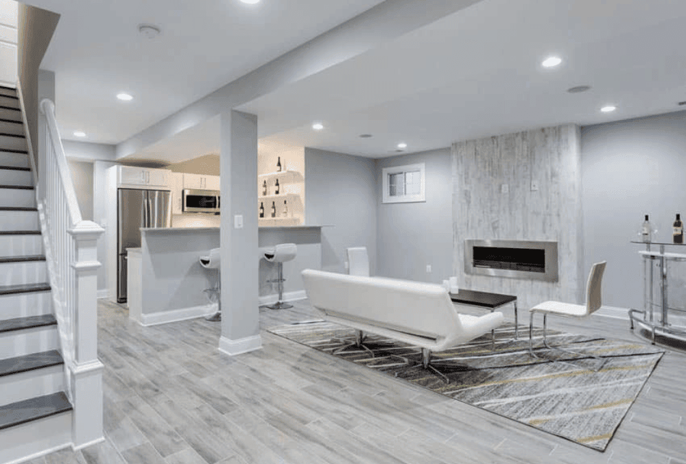 modern basement with epoxy flooring with small kitchen