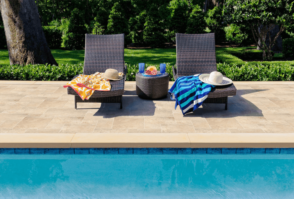 stamped concrete pool deck with chairs