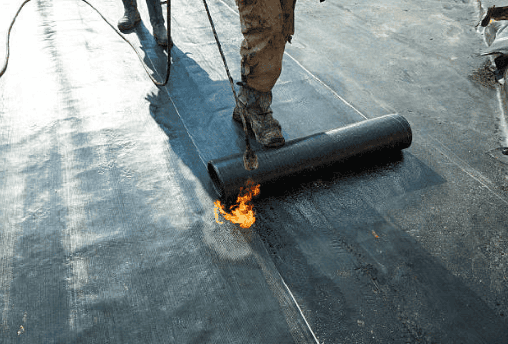 Concrete coating being tested for fire resistance, showcasing its durability and heat protection properties