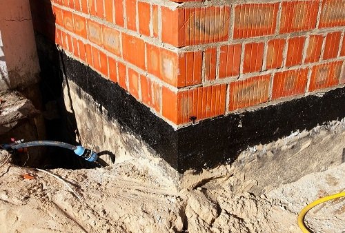 basement undergoing waterproofing outside