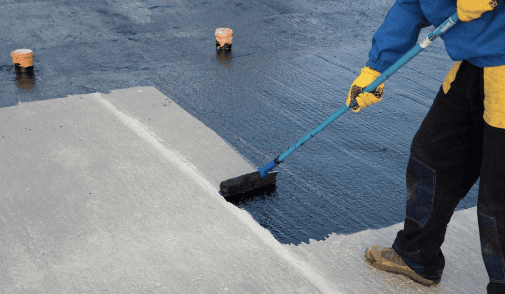 contractor applying waterproofing