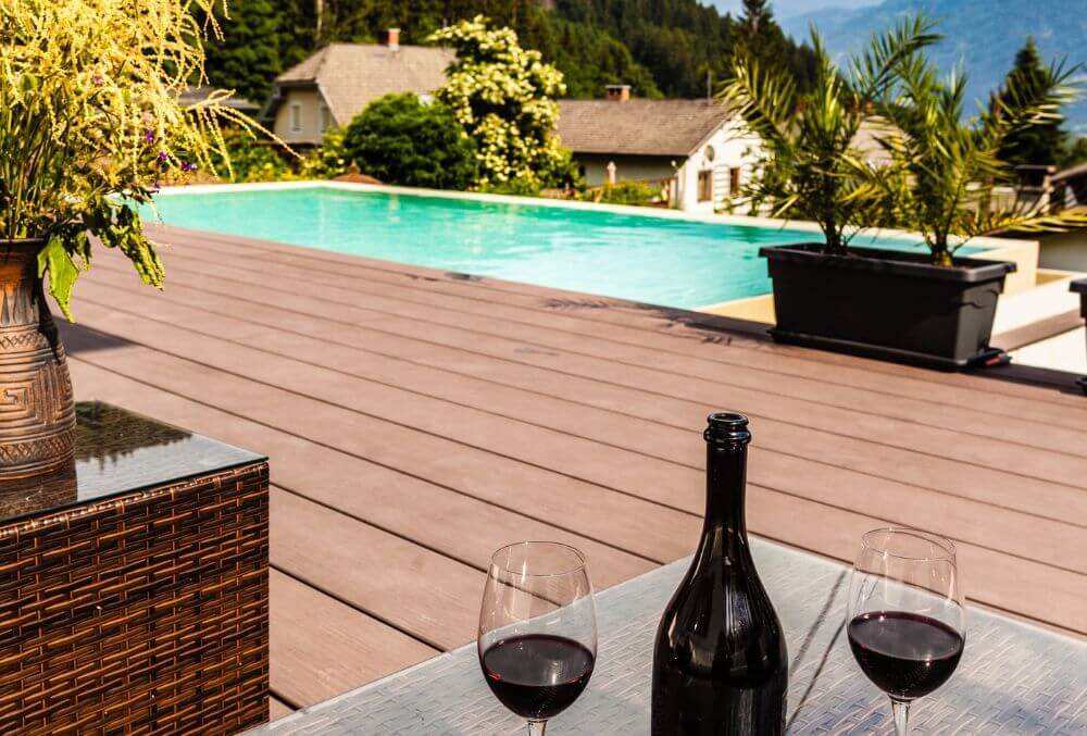 classy utilitarian pool deck with wine ang glass
