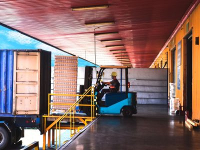 Concrete loading dock with a heavy-duty coating designed to withstand constant vehicle traffic, impact, and chemical exposure.
