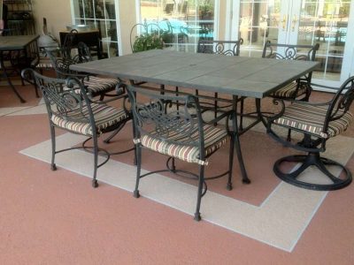 outdoor dining area with a colored concrete surface