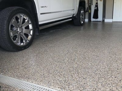 white pick up truck parked in a residential garage floor
