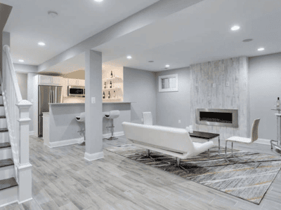 modern basement with epoxy flooring with small kitchen