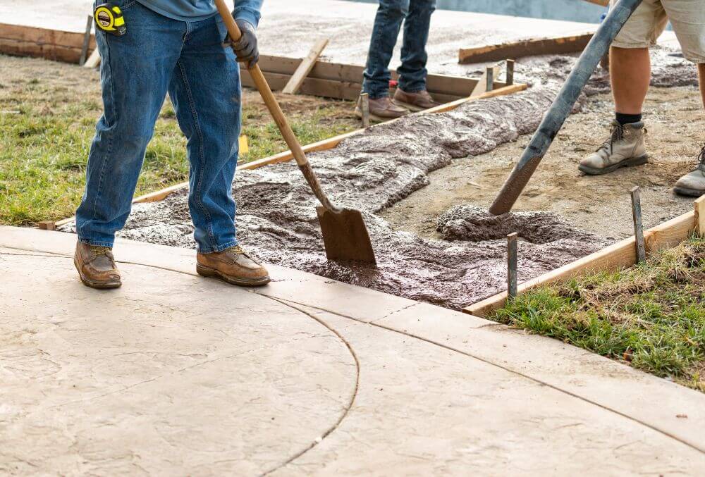 concrete contractors working on a concrete flooring installation