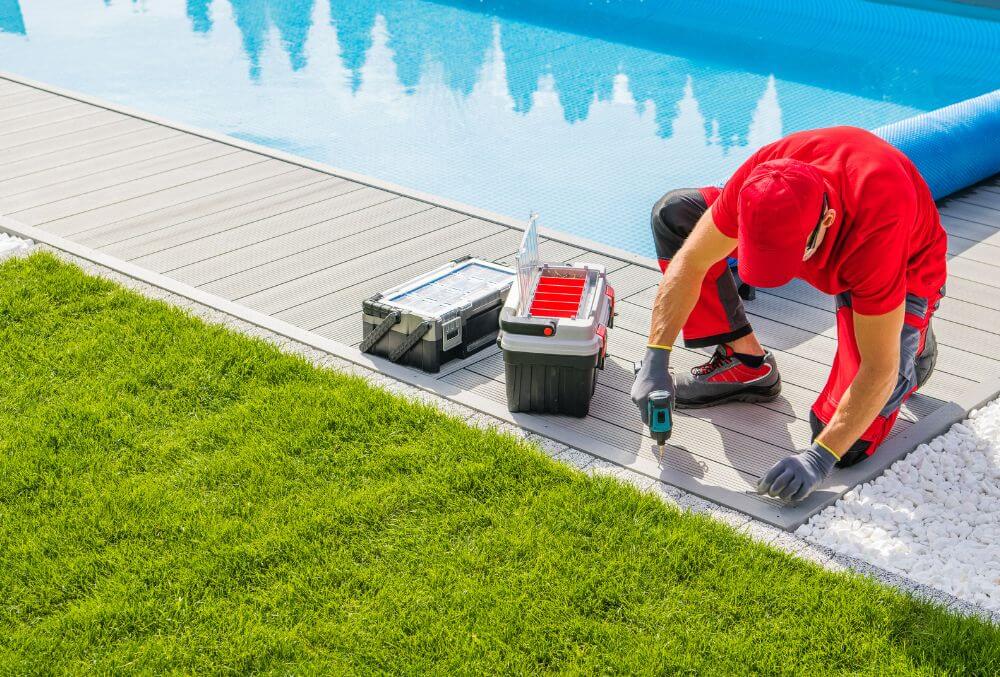 concrete contractor fixing the pool deck